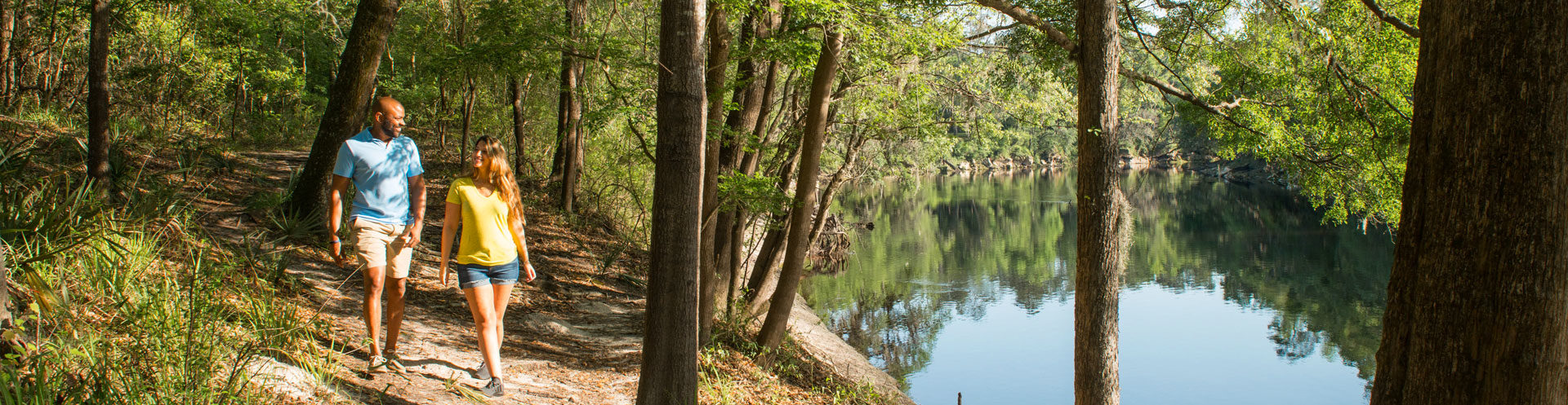 couple hiking on nature trail in suwanee