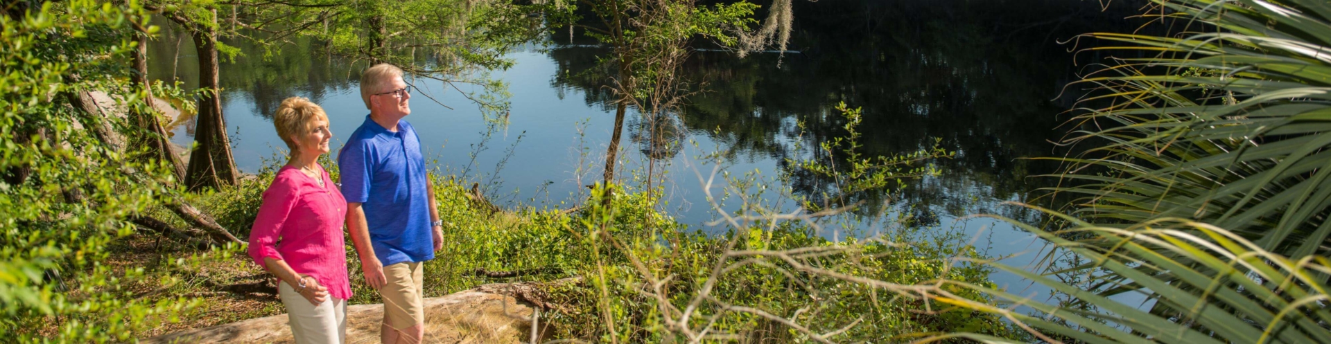 Couple looking at the river from Suwannee River State Park hiking trail