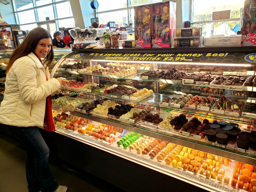 A customer stands in front of a display of candies and snacks at Busy Bee in Live Oak, Florida. 