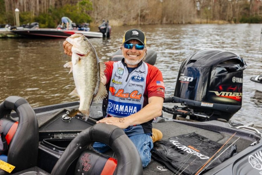 Ron Ryals, a local Suwannee County fishing guide, holds a largemouth bass that he caught in the Suwannee River.