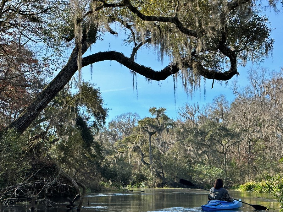 Woman kayaking down the Ichetucknee River