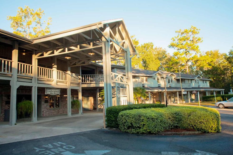 An exterior view of the wooden decor at The Village Lodge in Suwannee County, Florida.