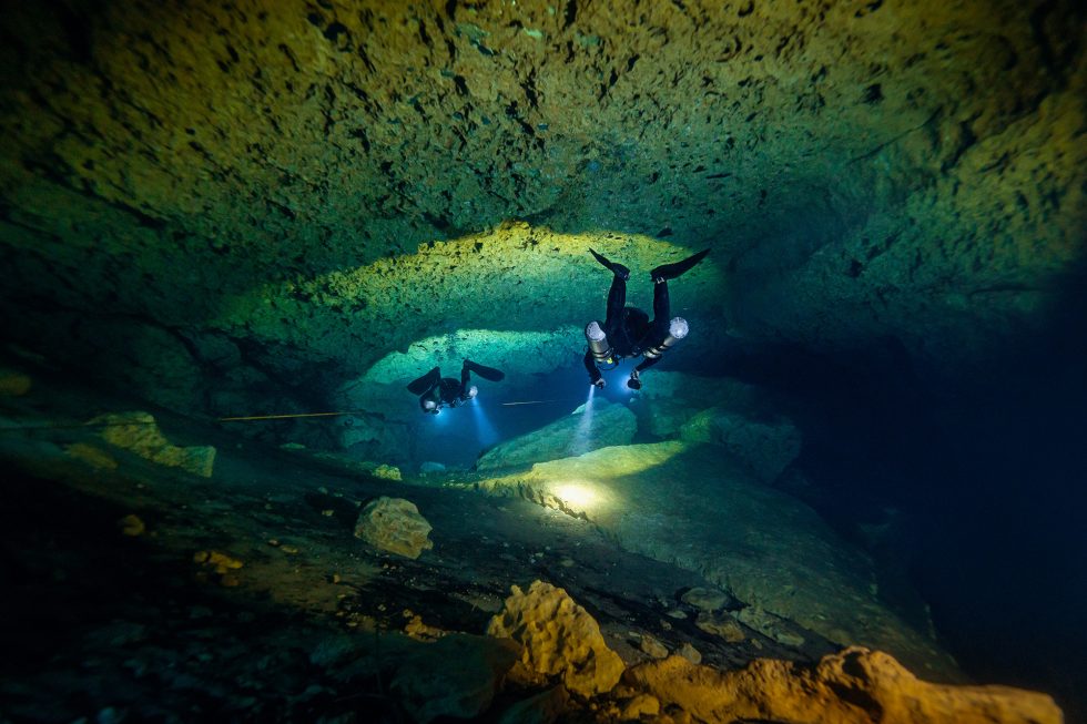Divers swim the tunnels at Orange Grove Sink in Suwannee County, Florida.